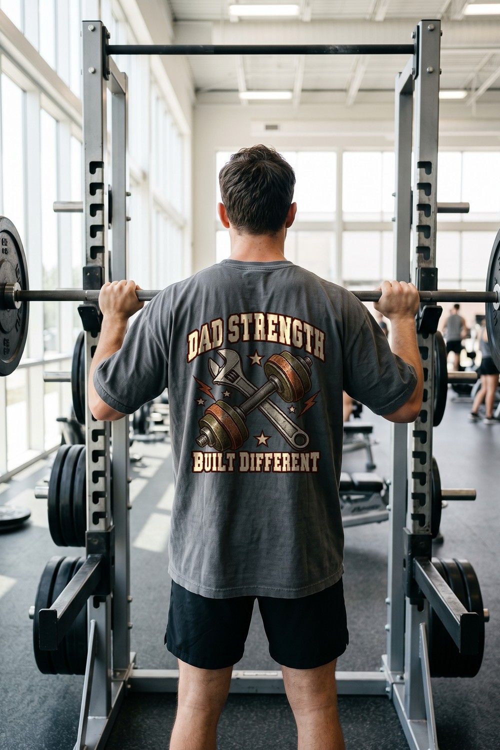 Man in a Dad Strength pump cover at the squat rack