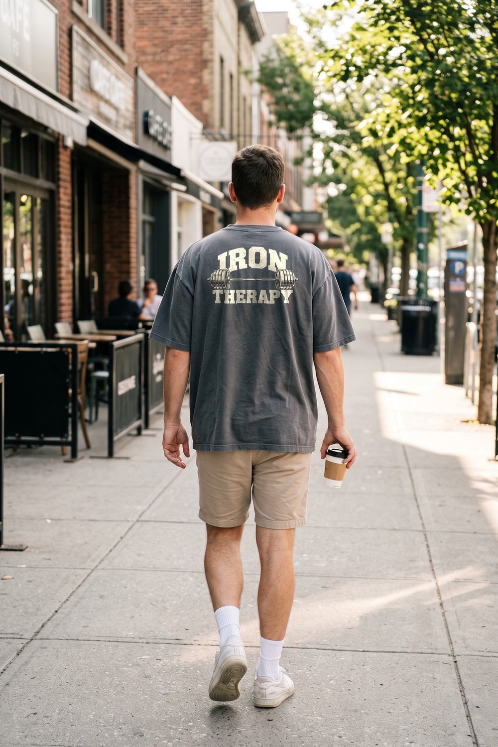 Man in an Iron Therapy oversized tee on the street
