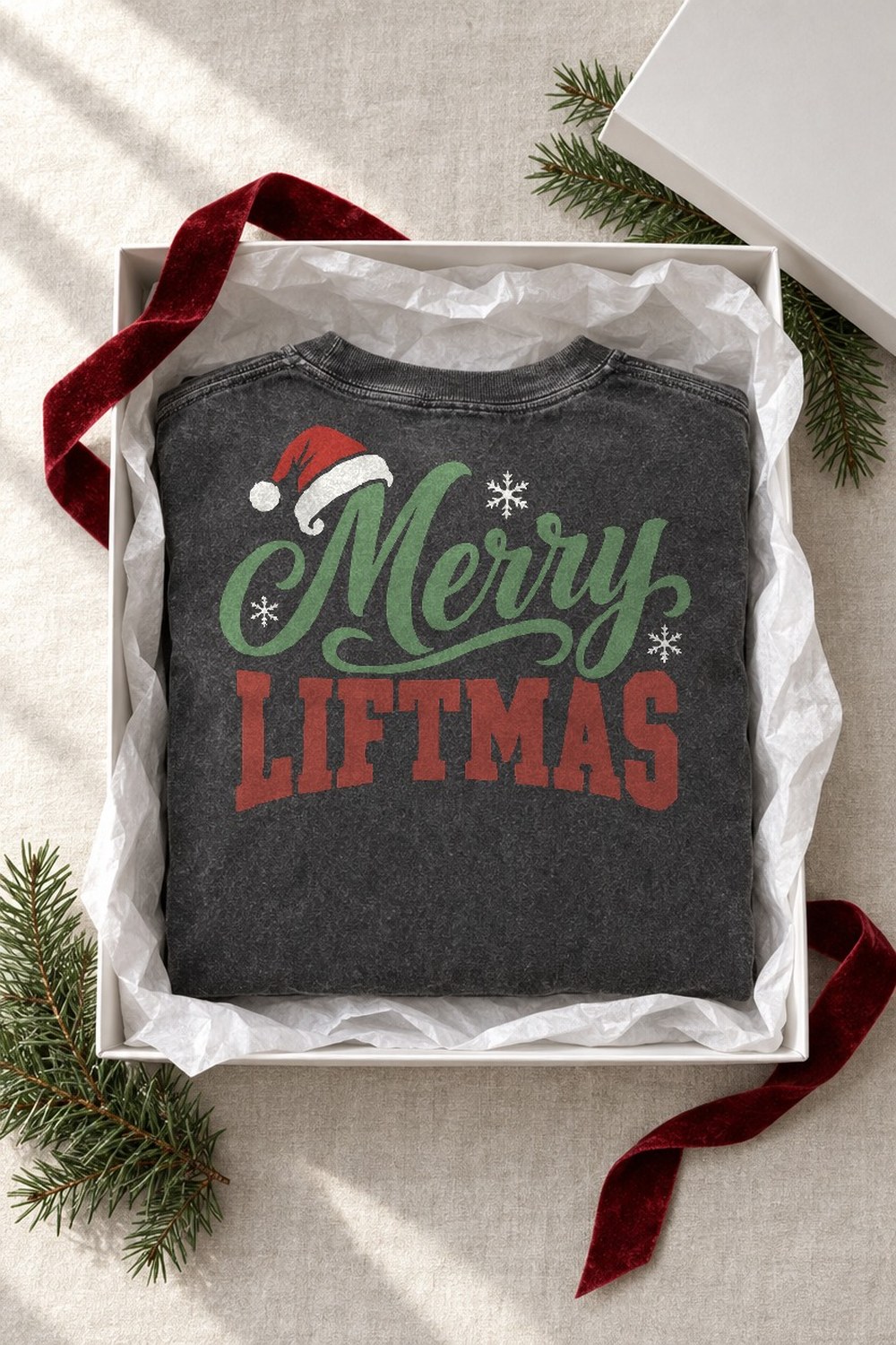 Merry Liftmas tee in a gift box