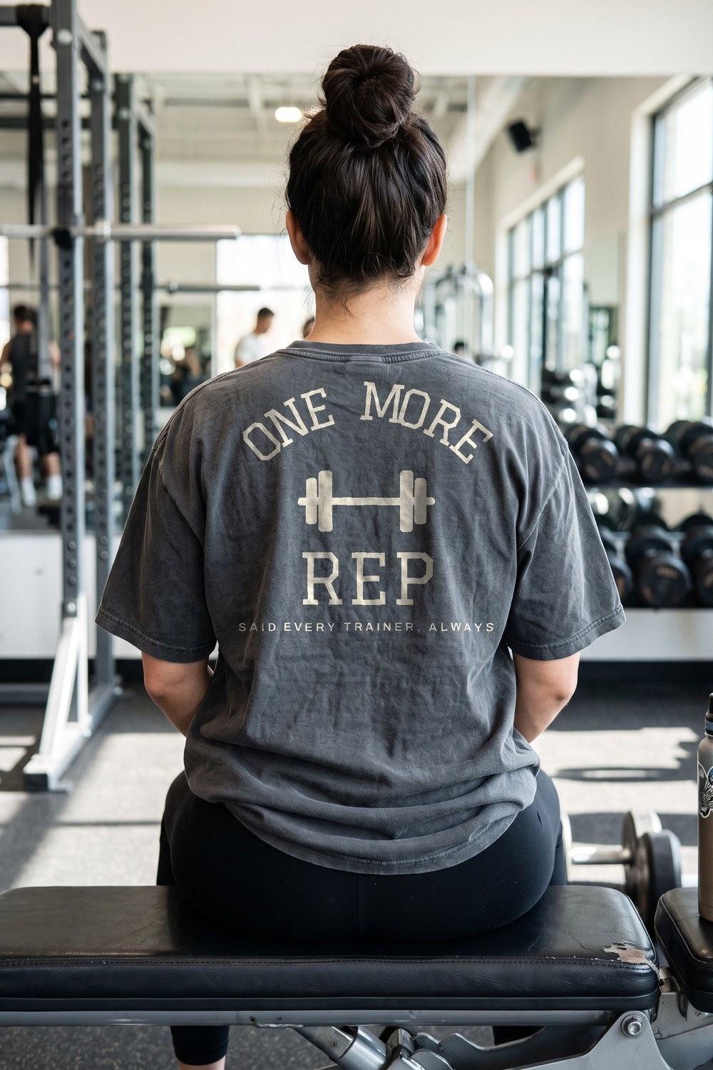 One More Rep oversized tee on a gym bench between sets