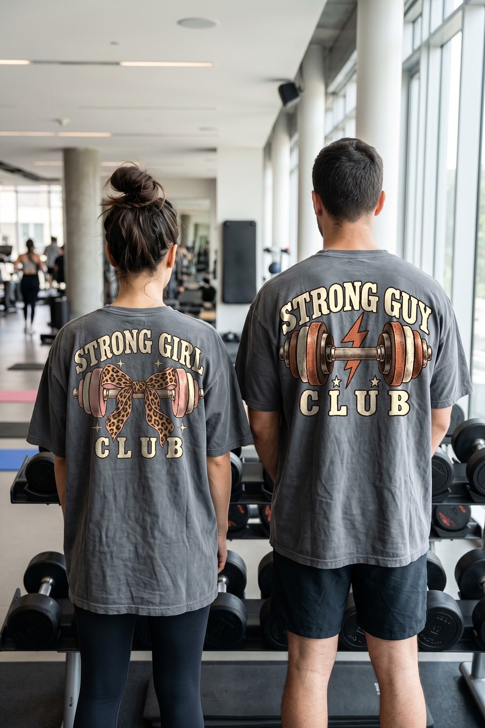 Strong Girl Club and Strong Guy Club tees at the dumbbell rack